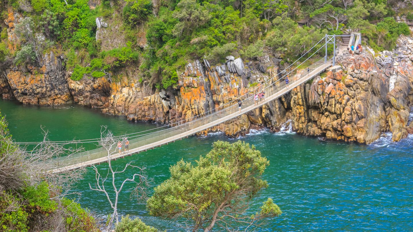 The Suspension Bridge over the Storms River Mouth within Tsitsikamma National Park, Eastern Cape, near Plettenberg Bay in South Africa. It is an important tourist destination along the Garden Route.
